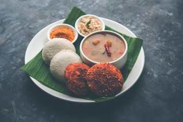 Podi idli is a quick and easy snack made with leftover idly. served with sambar and coconut chutney. selective focus