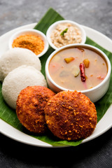 Podi idli is a quick and easy snack made with leftover idly. served with sambar and coconut chutney. selective focus