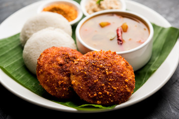 Podi idli is a quick and easy snack made with leftover idly. served with sambar and coconut chutney. selective focus
