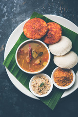 Podi idli is a quick and easy snack made with leftover idly. served with sambar and coconut chutney. selective focus