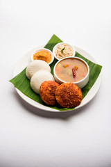 Podi idli is a quick and easy snack made with leftover idly. served with sambar and coconut chutney. selective focus