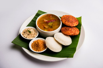 Podi idli is a quick and easy snack made with leftover idly. served with sambar and coconut chutney. selective focus