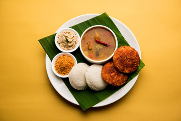 Podi idli is a quick and easy snack made with leftover idly. served with sambar and coconut chutney. selective focus