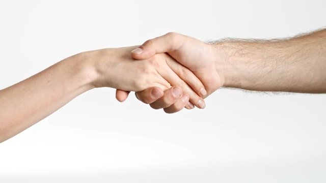Cropped view of man and woman handshake over white background isolated