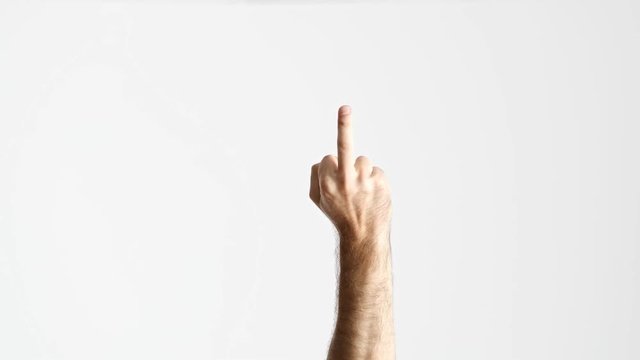 Cropped view of man showing middle finger like fuck you gesture with hand raised from below over white background isolated