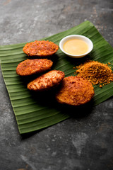 Podi idli is a quick and easy snack made with leftover idly. served with sambar and coconut chutney. selective focus