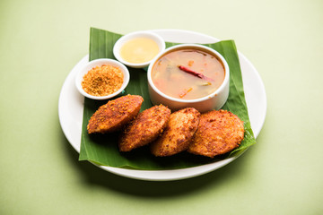 Podi idli is a quick and easy snack made with leftover idly. served with sambar and coconut chutney. selective focus