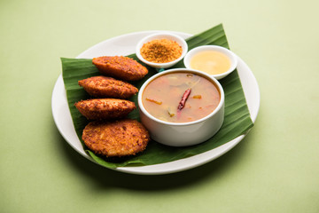 Podi idli is a quick and easy snack made with leftover idly. served with sambar and coconut chutney. selective focus