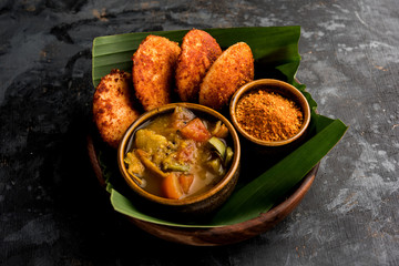 Podi idli is a quick and easy snack made with leftover idly. served with sambar and coconut chutney. selective focus