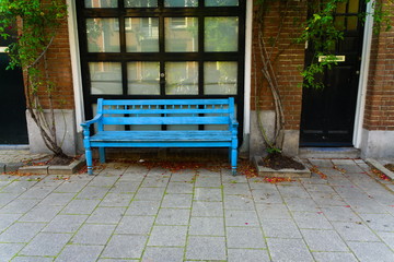 blue bench in the street of amsterdam