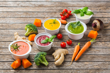 Set of seasonal fall autumn creamy soups on a table