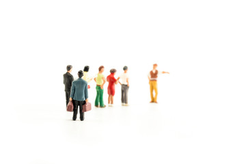 Miniature People Standing in a Line, Waiting