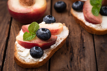 bread toast with peach and blue berry