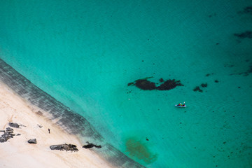 aerial view of kayak and turquoise water