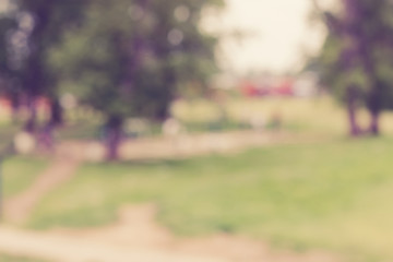 Abstract blurred background of city park in sunny day.
