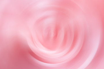 Creative abstract floral background of pink rose flower in swirly blurred motion. Elegant template...