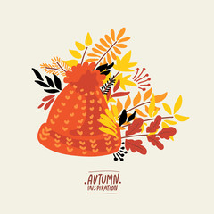 Autumn natural collection. Fall greeting card with knitted hat, red and yellow leaves, acorns, chestnuts, twigs.