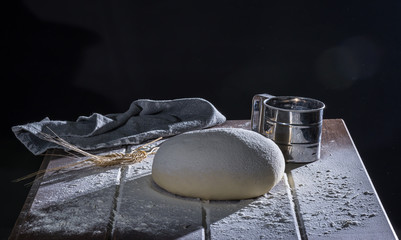 Risen yeast dough for bread or pizza 