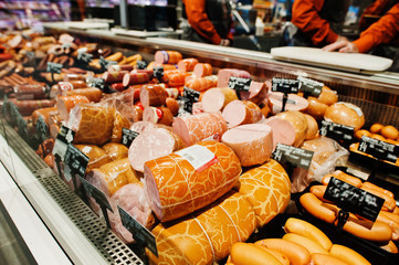 Milk sausages and various meat on supermarket.