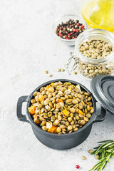 Brown lentil with vegetables. Top view, space for text.