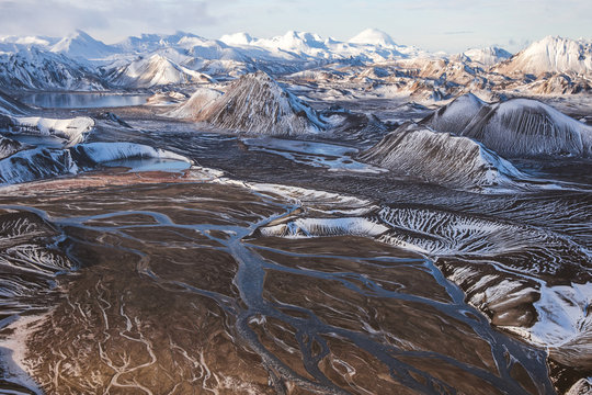 Snow trapped in between lower breaks in the mountain create a memorizing visual effect.
