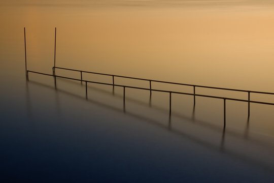 Bathing jetty at Lake Constance in the light of the sunset, Reichenau island, Baden-Wuerttemberg, Germany, Europe