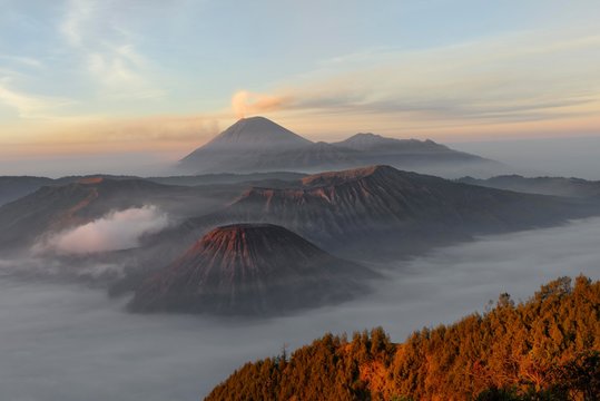 Sunrise over the smoking Gunung Bromo volcano, Bromo-Tengger-Semeru National Park, Java, Indonesia, Asia