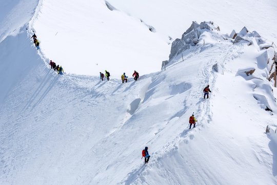 Group of climbers in snow on the way to Mount Blanc, Chamonix, France, Europe