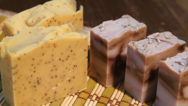 The concept of eco body care products. Colored decorative souvenir soap in assortment. Collection of decorative soaps for different needs in store display. Soap making, creativity.