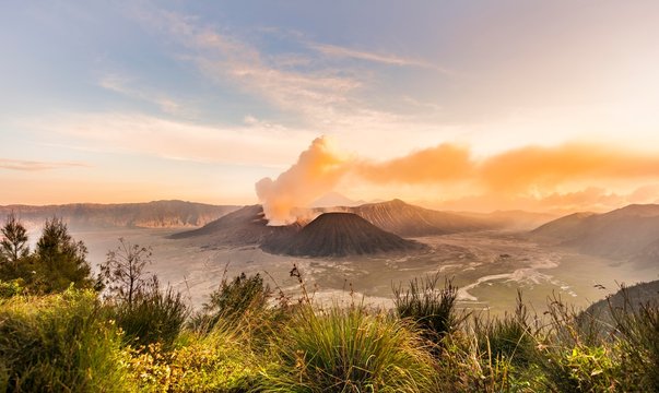 Sunrise, smoking volcano, Gunung Bromo, Mount Batok, Mount Kursi, Mount Semeru, Bromo Tengger Semeru National Park, Java, Indonesia, Asia