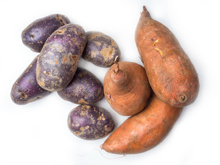 Pile of colorful fresh little potatoes over a white background