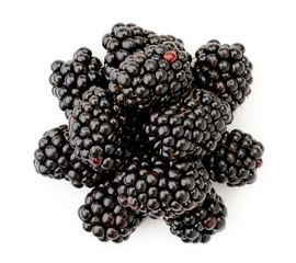 Pile of blackberries close-up on a white. The view of the top.