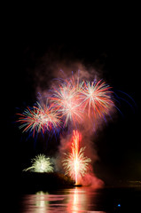 Colorful fireworks. Fireworks are a class of explosive pyrotechnic devices used for aesthetic and...