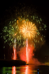 Colorful fireworks. Fireworks are a class of explosive pyrotechnic devices used for aesthetic and...