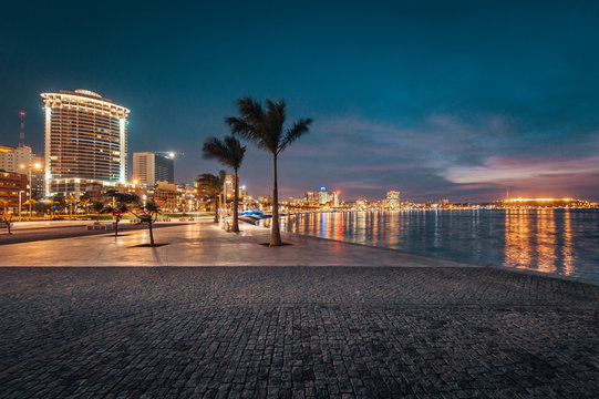 Picture of city buildings and ocean at night, Luanda, Angola