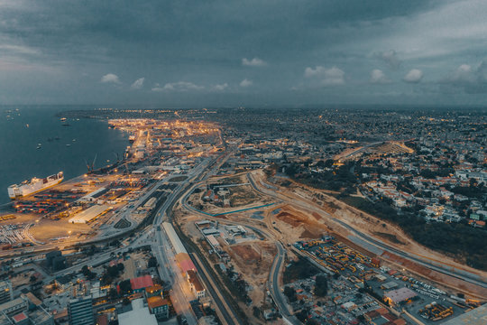 Scenic view of city and port at night