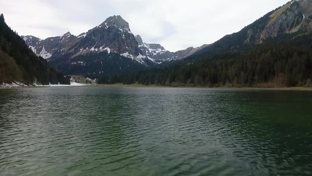 Mesmerizing beauty of Nafels Obersee lake amidst mountains, aerial shot