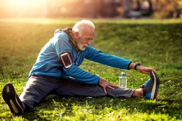 Senior man exercising in park