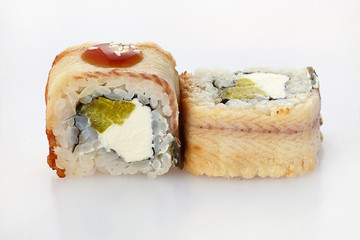 sushi rolls in salmon on a white background