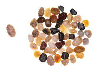 Leadership concept (the group follows the leader) made with a group of multi-colored stones (multicolored). Multidisciplinary and multiracial group concept. Isolated on white background.