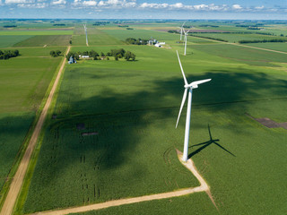 Aerial view of wind turbines turning in corn field on the border of South Dakota and Minnesota.