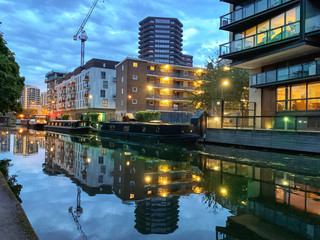 Buildings reflected in the canal in Little Venice of London at dusk to down, England, UK