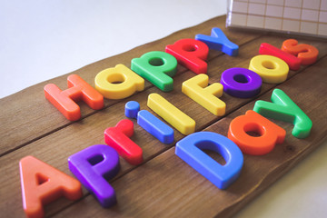 Fototapeta premium Happy April Fools Day Text with Colored Letters