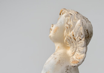 Statue of an angel on light grey background, vintage design. Space for text. Concept for religion,...