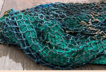 Old Fishing Net Piled at a Harbour
