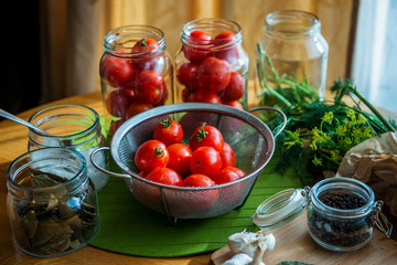 Fototapeta na wymiar Fresh tomato and ingredients for conservation. Preparation marinated salted tomato