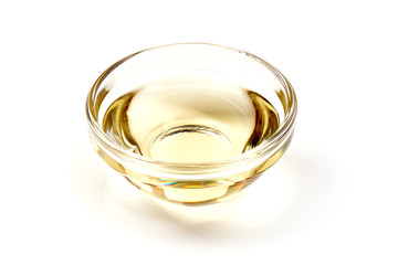 Apple vinegar in a glass bowl, isolated on white background