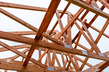 Roof trusses not covered with ceramic tile on a detached house under construction, visible roof...