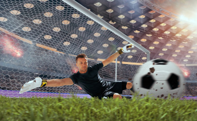 Soccer players in action on professional stadium on sunset.
