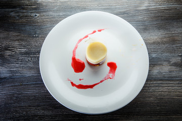 top view on finely decorated berry and cream mousse dessert